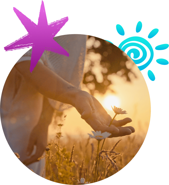 Hands gently cupping sunlight in a serene outdoor setting at sunset.